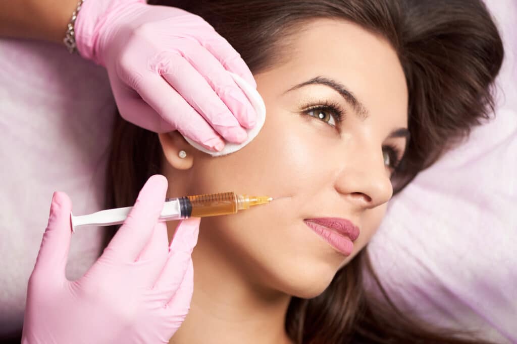 A close-up shot of a woman getting JUVÉDERM® fillers in West Des Moines A close-up shot of a woman getting JUVÉDERM® fillers in West Des Moines