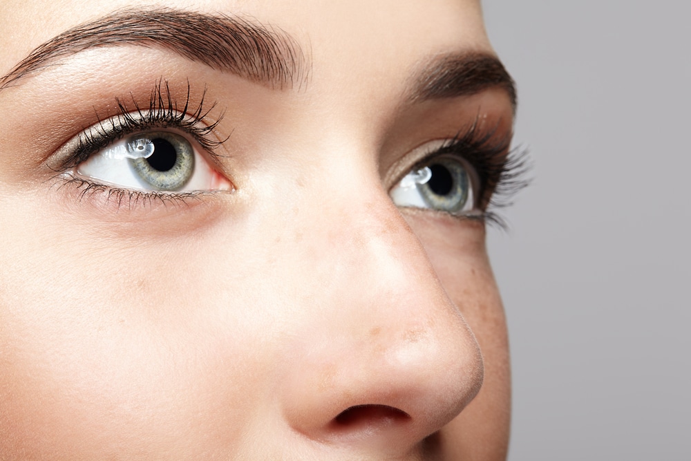 Close-up of a woman’s eyes showing open upper eyelids and long lashes. Close-up of a woman’s eyes showing open upper eyelids and long lashes.